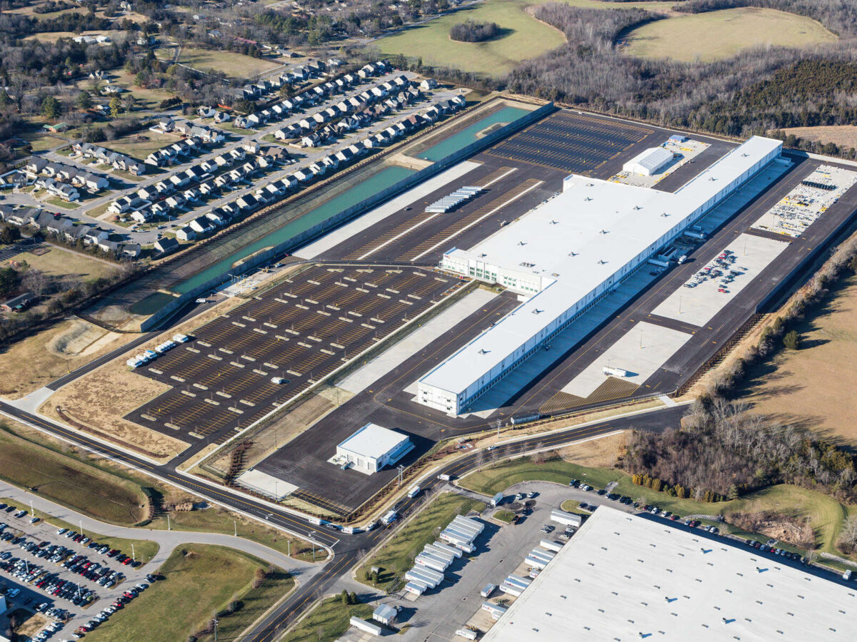 A drone shot of an industrial plant surrounded by fields