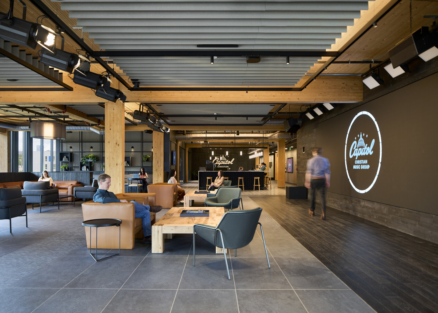 people working in a lounge in an office