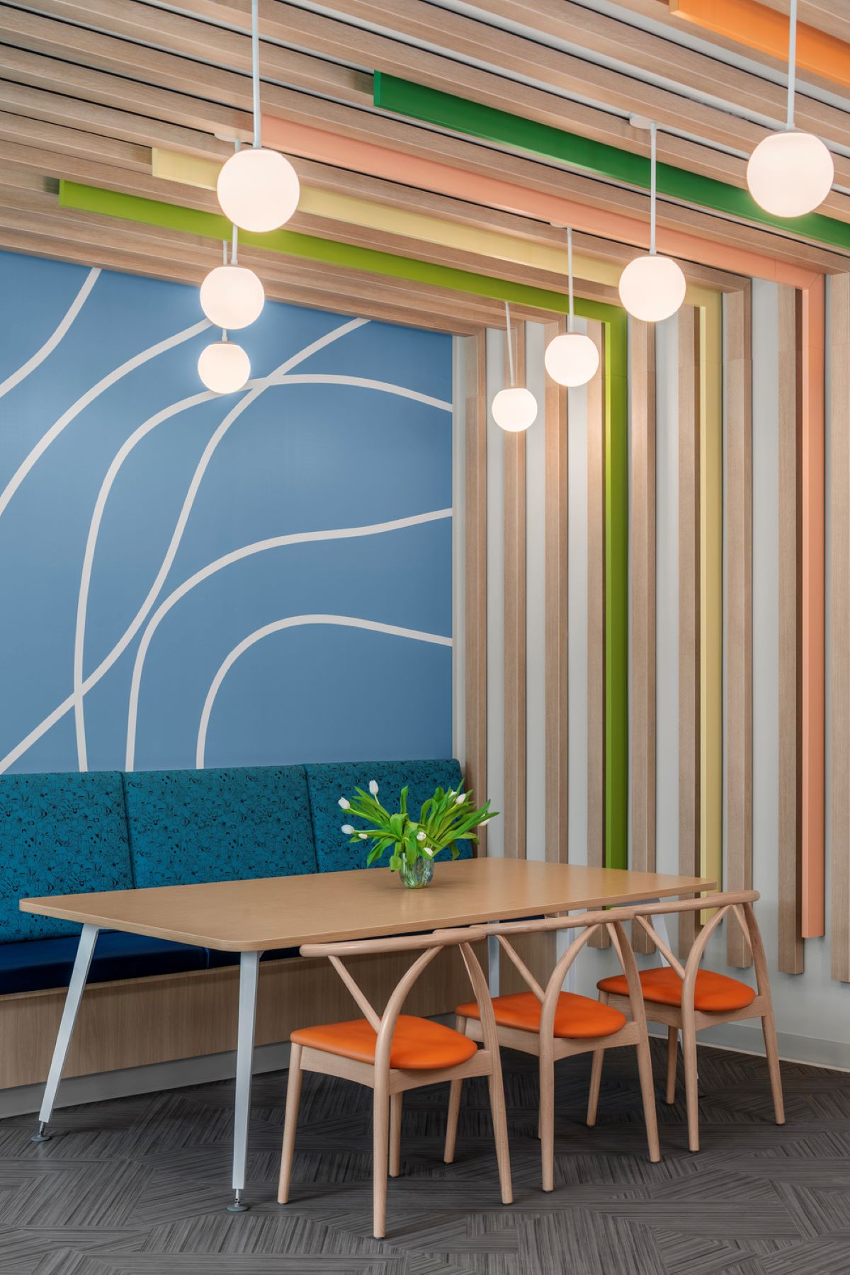 a table and chairs in a colorful seating area