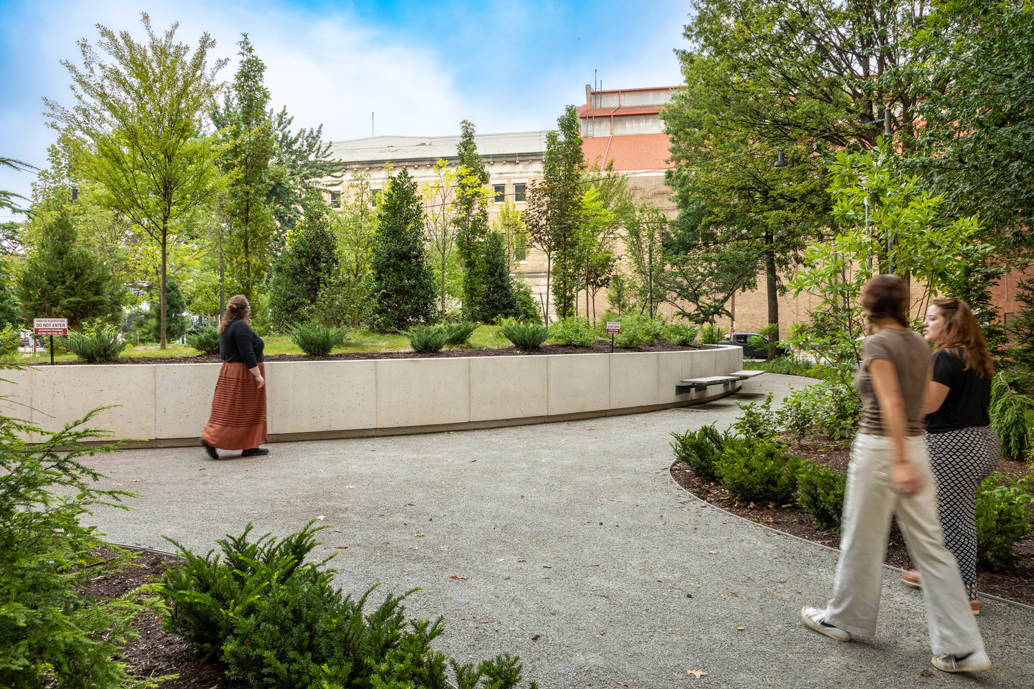Pedestrians walking through the Trager MicroForest