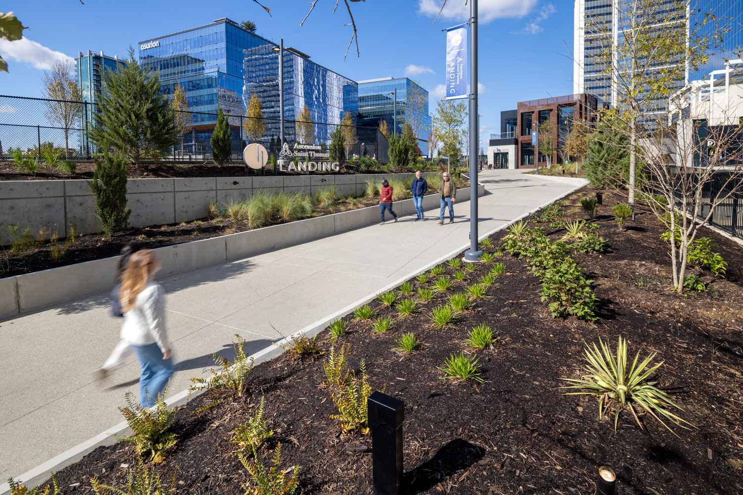 Pedestrians walking in the Ascension St. Thomas Landing