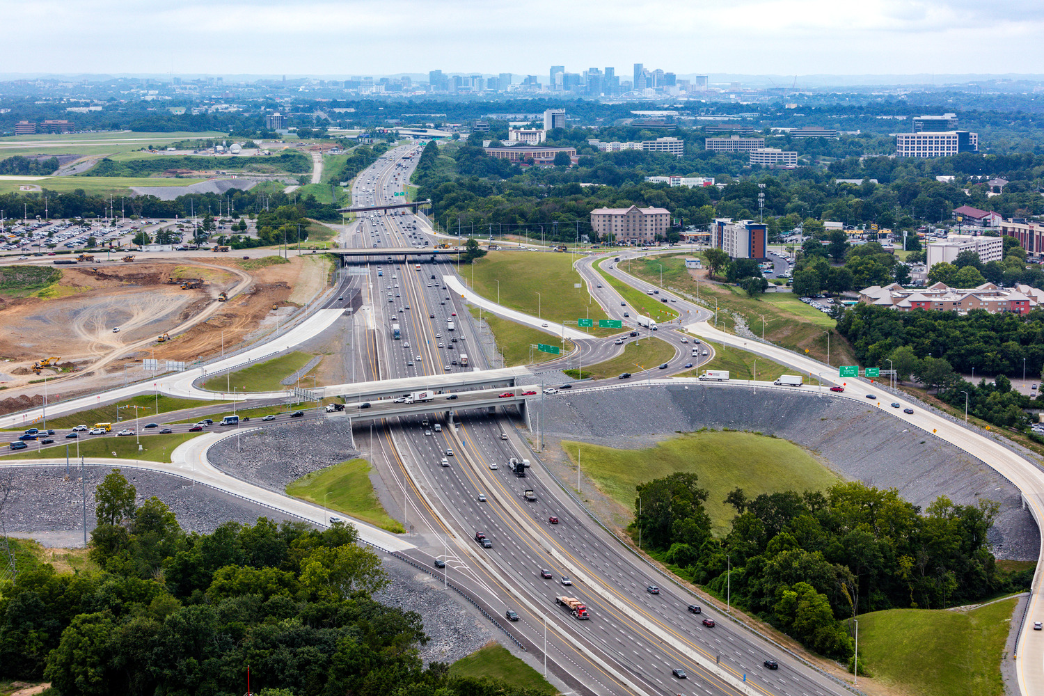 The completed diverging diamond interchange near the Nashville International Airport with Nashville skyline in distance