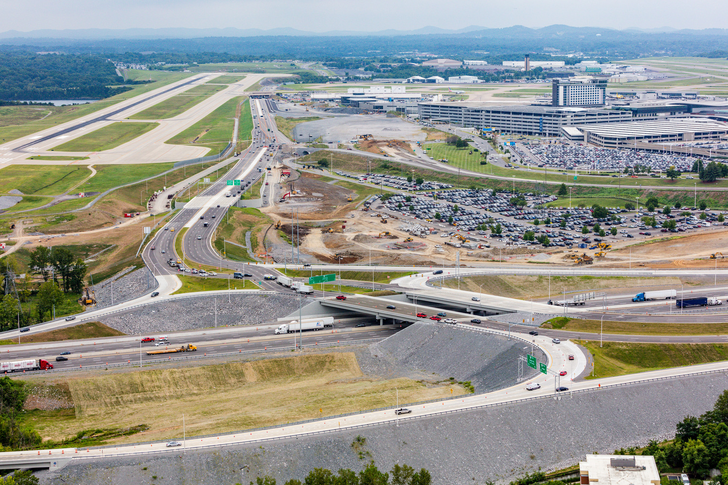 The completed diverging diamond interchange near the Nashville International Airport with Nashville skyline in distance