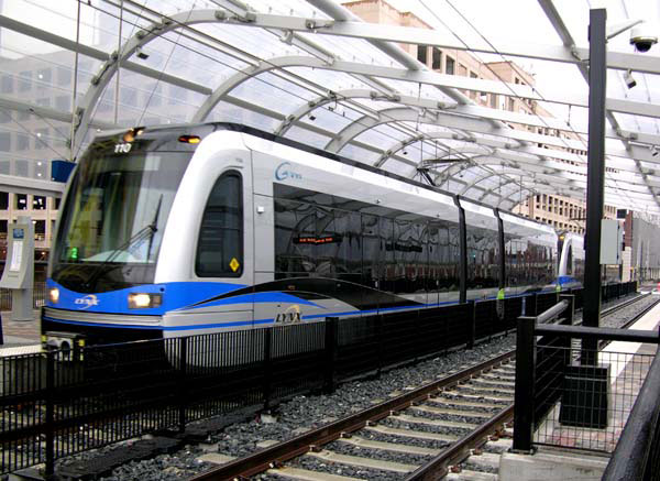 A light rail train prepare to depart Charlotte Transportation Center/Arena (LYNX station) in Center City Charlotte.